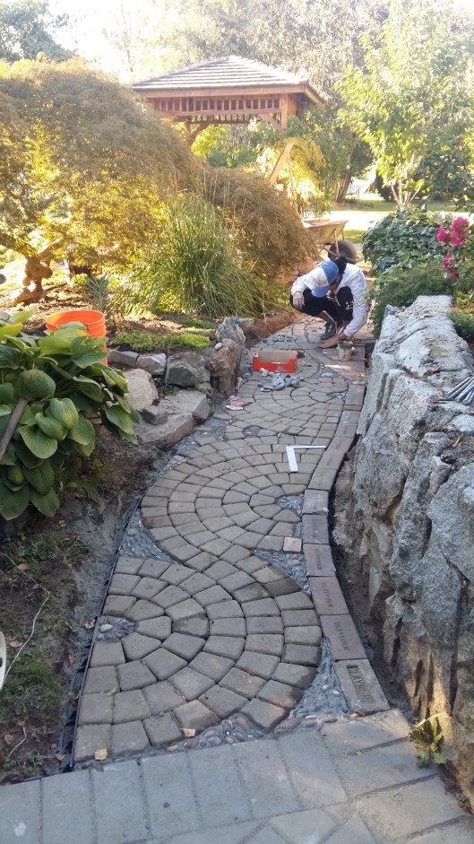 We thought we wouldn't have a chance to even lay the pavers on this side of the path...but we worked long hours toward the end of the week to see that we had a frame work we could at least see take shape.